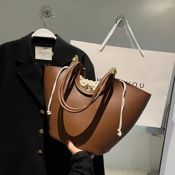 Vintage stílusú válltáskák nőknek Húzózsinóros vödör táska Pure Color Nagy kapacitású vásárlói táskák 2023 Luxus designer kézitáska